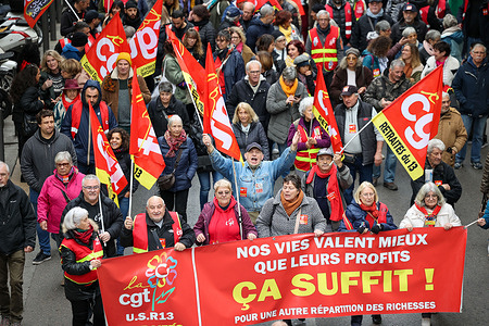 Protesters hold up a banner proclaiming: "Our lives are worth more than their profits" during the demonstration against the government's budget. Approximately 1,000 people demonstrated in the streets of Marseille at the call of the CGT, FSU, and Solidaires unions against the French government's budget, which includes doubling medical co-pays and freezing retirement pensions and social benefits.
