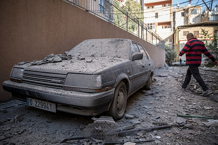 View of a damaged car following an Israeli airstrike in Chiyah, greater Beirut. An airstrike hit a building which housed businesses including a clothes shop, women's gym, construction company and medical centre. Since September, Israel has been carrying out one of the most intense aerial campaigns in the history of modern warfare across much of Lebanon.