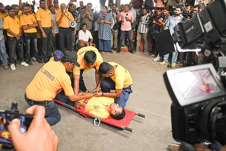 Members of a civil defence team demonstrate a mock drill on how to carry injured person on a stretcher in case of emergency during a war at Chhatrapati Shivaji Maharaj Terminus (CSMT) in Mumbai. Indian armed forces carried out air strike named 'Operation Sindoor' with focused missile strike demolishing nine terrorist camps situated across the border in Pakistan between 1:05am-1:30am Indian Standard Time (IST) on Wednesday to avenge the recent attack in Pahalgam by terrorist belonging to 'The Resistance Front' (TRF), a shadow outfit of the banned Lashkar-e-Taiba which killed 26 tourists in the union territory of Jammu and Kashmir.
