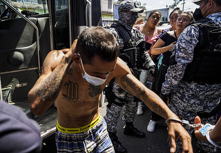 Police officers escort an alleged gang member into a detention center. On Sunday, March 27, the Salvadoran Congress approved a State of Emergency after the country registered its highest daily murder toll, with 62 gang-related homicides. According to the Salvadoran government, more than 3,000 alleged gang members from the MS-13 and Barrio 18 gangs have been detained.