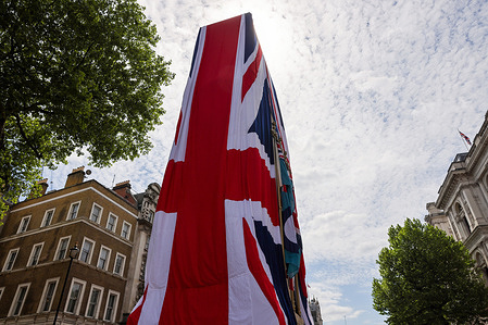 The Cenotaph in Whitehall is seen draped in a large Union Flag to mark the 80th anniversary of Victory in Europe (VE) Day. This is the first time the war memorial has been adorned in this way since it was unveiled by King George V in 1920. VE Day, observed on May 8, commemorates the Allied victory and Nazi Germany’s surrender in World War II.