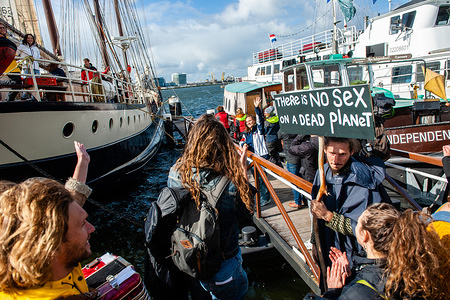 climate activists are seen saying goodbye to their families before the boat departs.
From the NDSM Wharf in Amsterdam, 36 climate activists are sailing out to go to the UN Climate Conference in Santiago, Chile. Between them, there is Anuna de Weber, who is the organizer of the Climate Strikes in Belgium and Adélaïde Charlier, French-speaking coordinator for the 'Youth for climate' movement. Their mission as Greta Thunberg already did, is decrease the climate impact of traveling. They will be sailing for around 7 weeks to Rio de Janeiro, and from there they will travel by bus.