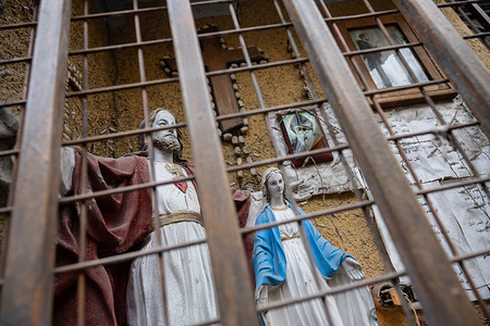 Christian icons and symbols on display in a narrow street of the Christian Quarter of Damascus Old City.