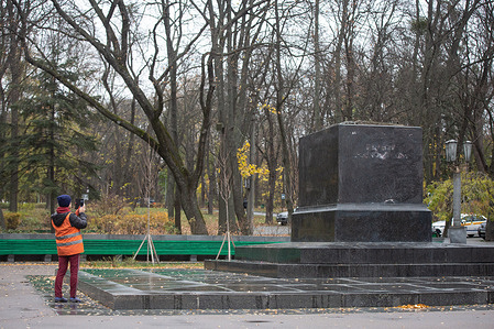 A woman takes photos of an empty pedestal in the park where there used to be a monument to the Russian poet Alexander Pushkin, which was recently dismantled by Kyiv municipal services. After the Russian invasion, Ukraine actively pursues de-Russification, abandoning the names, personalities, symbols and ideology of Russia in all spheres of life.
