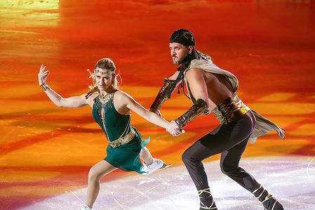 Maxim Trankov (R) and Tatiana Volosozhar (L), athletes perform in the second part of the figure skating program during the Ice Show of the Eteri Tutberidze team - Champions on Ice in St. Petersburg, at the Yubileyny sports complex