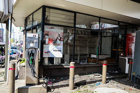 A view of a vandalized shop and fuel pump belonging to Total Energies after goons infiltrated a peaceful demonstration marking one year since protesters stormed parliament in opposition to a finance bill that was proposing punitive taxes.