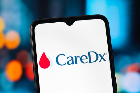 In this photo illustration, the CareDx logo is seen displayed on a smartphone screen.