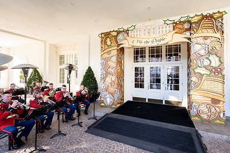 “The President’s Own” United States Marine Band performing outside an entrance to the East Wing at a preview of the holiday decorations at the White House.