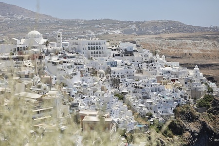 The town of Fira, on the edge of the cliff overlooking the Santorini caldera, in the Cyclades, Greece.