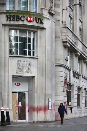 A member of the public walks past an HSBC branch with red paint sprayed on the wall after pro-Palestinian activists target it overnight. Autonomous pro-Palestinian activists target HSBC bank branches around the UK repeatedly. They accuse HSBC of being a large investor of Israeli arms company Elbit Systems. Elbit Systems produces weapons for the Israeli military used against Palestinians in Gaza and their weapons are produced in factories across the UK. They demand Elbit Systems closes their six remaining UK facilities and threaten companies working with Elbit and complicit as they see it of supporting Israel, that they will be targeted with direct action.