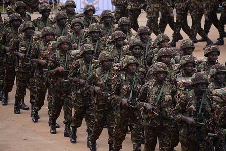 Kenya Defence Forces (KDF) soldiers match during a parade at Uhuru Gardens in Nairobi during Kenya's 59th Madaraka day, the day when the country attained internal self-rule.