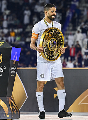 Al Sadd SC caption Hasan Khalid Alhaydos, hold the trophies during the Qatar-UAE Super Shield final between Qatar's Al Sadd SC and UAE's Shabab Al Ahli Dubai FC at Jassim Bin Hamad Stadium. Final scores; Qatar's Al Sadd SC 3-2 UAE's Shabab Al Ahli Dubai FC.