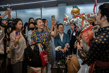 Chinese tourists are welcomed by Thai traditional puppet dance performance after arriving at the Suvarnabhumi International Airport during a welcoming ceremony to mark the first day of the government's visa-free scheme. In an attempt to boost tourism, starting Sept. 25, the Thailand government is granting Chinese and Kazakh tourists a temporary visa exemption for 30-day visits. The waiver is due to expire at the end of February.