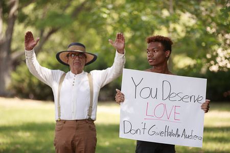 George Edward Smock, aka Brother Jed, left, preaches. Later he was led away to a police car after preaching about religion, criticizing students, and talking about politics to a group of students Wednesday, September 11, 2019 at Indiana University in Bloomington, Ind. Smock's wife, Cynthia D. "Cindy" Lasseter, was also taken to a separate police car. The couple were cited for trespassing, and asked to leave. The preachers had been preaching to students near Woodburn Hall for several hours, and spoke to students in descriptive terms about sexuality, religion, and other subjects. As Smock began using phrases such as, "build the wall," and expressing his support for United States President Donald J. Trump, a group of students began to surround him, and the mood of the group surround him changed from amusement and mockery, to a more threatening tone of derision and disgust, and that's when members of the IU police department moved in to peacefully defuse the disturbance. Earlier in the day police had been called to the scene after a confrontation involving at least one person, and the preachers, and police discussed in scanner traffic detaining the couple, and moving them to another location to talk to them. A group of at least 100 students had been surrounding the couple, and at least four had moved into a zone of a few feet from Smock. For a while police stayed back, and let the couple preach. The couple are widely known on campus for preaching to students, and had been on campus several times in the past few days.