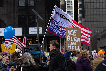 Protestors seen holding up placards at the ‘No War, No Kings’ rally. Protestors gathered outside the Central Park in New York City in response to the Trump administration’s invasion of Venezuela, as well as the killing of U.S. citizen Renée Good by an ICE officer in Minneapolis, Minn.