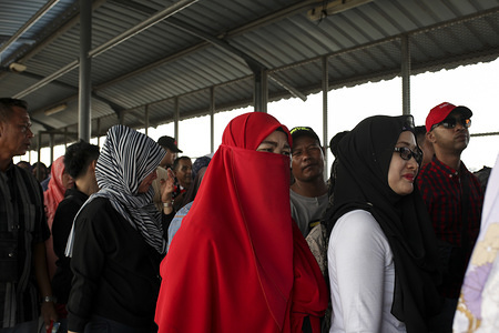 Passengers waiting to board the ferry departing to Tanjung Balai in Port Klang ferry terminal. Thousand of Indonesian who work and live in Malaysia were expected to return home through Tanjung Balai, ahead of Eid al-Fitr celebration on June 15, 2018.