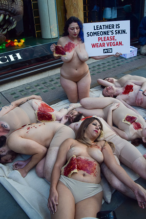 PETA (People for the Ethical Treatment of Animals) activists lie outside the Coach store on Regent Street with fake torn skin and blood, and a placard stating 'Leather is someone's skin, please wear vegan' in protest against the use of leather in the brand's handbags and other products. The Black Friday action is part of the animal rights group's ongoing campaign against the use of leather made from animal skins and urges companies like Coach and consumers to choose vegan alternatives.
