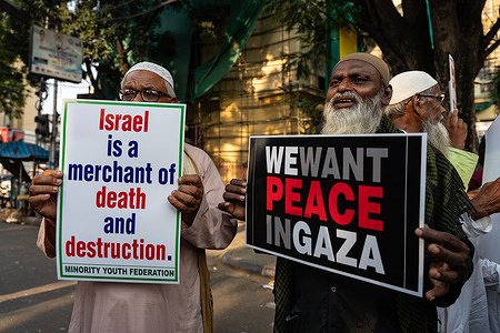Protesters hold placards demanding peace in Gaza and against Israel - Palestine conflict, while taking part in a rally against Israel. Members of Minority Youth Federation of Kolkata staged a protest against Israel - Palestine conflict by chanting slogans while holding placards against the war that's going on.