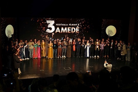 Filmmakers attending the ceremony are seen greeting the audience at the awards ceremony. The awards ceremony for the 3rd Amed International Film Festival, held in city of Diyarbakir in Turkey, took place at the CandAmed Cultural Center.