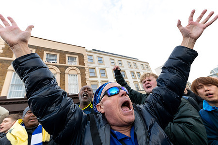 Protester changing football slogans. Chelsea supporters gathered outside Britannia Gate ahead of the home fixture against Brentford to stage a peaceful, fan-led protest calling for accountability and structural change at Chelsea Football Club. Supporters criticised the club’s ownership model, recruitment strategy, and leadership direction since the takeover, urging an end to micromanagement and a return to sustained competitive ambition at the highest level of English and European football.