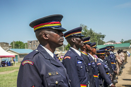 Kenyan police officers wearing ceremonial uniform participate in a parade during the commemoration of 61st Madaraka Day. A contingent of Kenyan Police is awaiting deployment to lead a Multinational Security Support Mission(MSS) to Haiti.