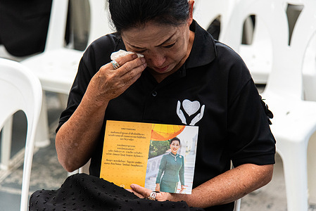 A mourner seen crying while holding a portrait of Thai Princess Bajrakitiyabha after the announcement of her death at the Chulalongkorn Hospital. Princess Bajrakitiyabha passed on at the age of 47 on 12 June 2026 at the Chulalongkorn Hospital after three and a half years in a coma following a collapse caused by a heart condition in December 2022.