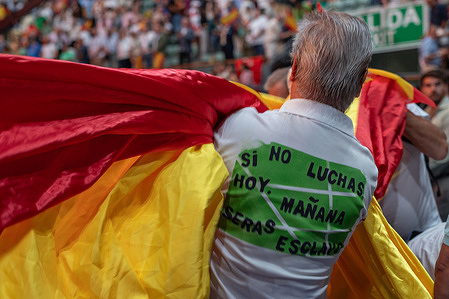 Supporters of the far-right party Vox Spanish flags gather during the "Europe Viva 2025" event, held at the Vistalegre Palace in Madrid. Europa Viva 2025 is the convention of the Spanish far-right party VOX, which this year was held under the slogan "For a new and decent Europe."