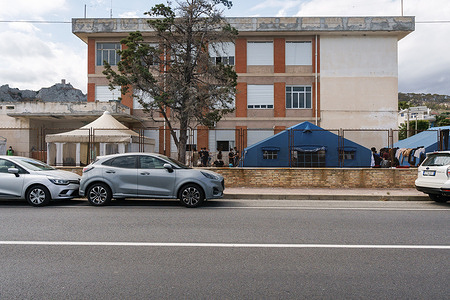 Exterior view of the first aid centre with provisional shelters.
Nearly 230 migrants, floating towards Italy, have been rescued by the Italian coast guard and taken to the port town of Roccella Jonica in the southern region of Calabria. Women, children and men of different nationalities have been taken to the local first aid centre for assistance and identification.
