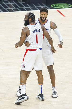 Los Angeles Clippers' Paul George (R) celebrates with James Harden (L) after the team defeating the Brooklyn Nets during an NBA basketball game at Crypto.com Arena.
