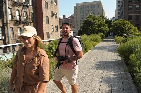 People walk on the High Line in Manhattan, New York City.