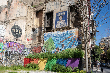 Walls seen covered with graffiti in the Exarcheia neighborhood. Vibrant neighborhood, Exarcheia is located in the central part of the city. It is often referred to as the anarchist neighborhood. It has an edgy alternative vibe, its streets decorated with politically charged murals and posters. Bars, bookshops and restaurants are found everywhere on the streets.