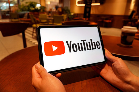 In this photo illustration, the YouTube logo is displayed on the screen of a smart tablet.
