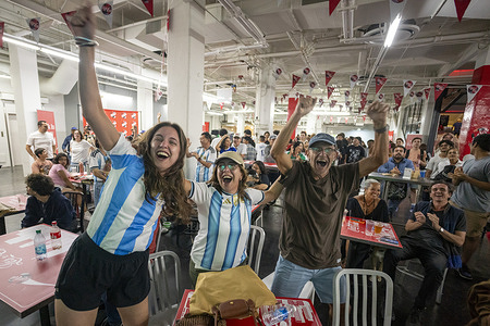 Soccer fans cheer on as they watch a live broadcast of the FIFA World Cup Round of 32 soccer match between Argentina and Cabo Verde during a watch party at Sofi Stadium.
