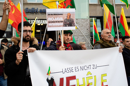 Protesters hold a banner, placard and flags during the demonstration.
Demonstration against the military operations of Turkey in Syria.