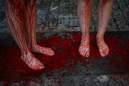 Two activists have their lower bodies covered in fake blood during a demonstration a day prior to the San Fermin Festival 2026. PETA (People for the Ethical Treatment of Animals) activists stage a demonstration to condemn bullfighting, "Thou shalt not kill" protest as they carry signs that read "bullfighting is a sin" in several languages in Pamplona.