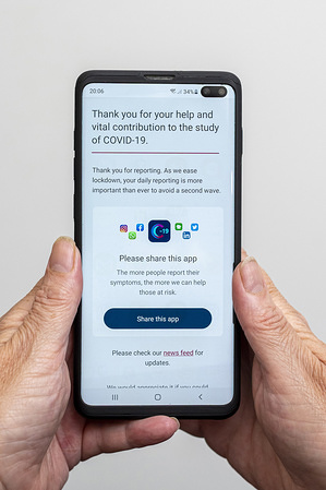 In this photo illustration, a Covid-19 tracker app made by a research group at King’s College London to track the spread of the virus seen displayed on a smartphone.
The app takes 1-min to report your daily health and allows anyone who suspects they have the disease to input their symptoms daily. 3,797,713 people are currently using the app.