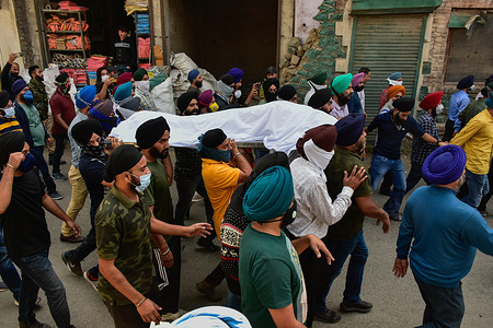(EDITORS NOTE: Image depicts death)
Sikh mourners carry the dead body during a funeral procession of slain Supinder Kour.
The principal and teacher of a government school were killed by unknown gunmen suspected to be militants in Srinagar, the latest in a spate of targeted killings in the Kashmir valley. The attack comes less than 48 hours after three persons were shot dead in strikes. The victims were from Sikh and Hindu communities. The teacher, Deepak Chand, was a Hindu from Jammu and the principal, Supinder Kour, was a Sikh.