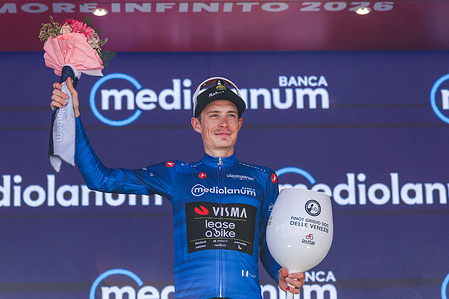 Jonas Vingegaard of Denmark (Team Visma | Lease A Bike) celebrates on the podium as Blue Mountain Jersey winner during the 109th Giro d'Italia 2026, Stage 13, a 189km stage from Alessandria to Verbania