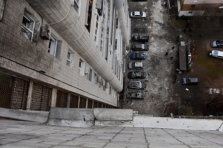 Aerial view of a yard with damaged cars after a Russian drone strike during Russia's attack on Ukraine. Russia continues to attack Ukrainian cities especially the capital Kyiv with dozens of kamikaze drones every day in the third year of a full-scale military invasion.