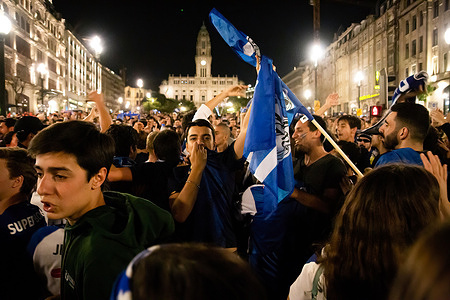 Fans of Futebol Clube do Porto shout slogans as they celebrate the victory of the 30th national champion title at Avenida dos Aliados in Porto. FC Porto (Futebol Clube do Porto) won against S.L. Benfica (1-0)