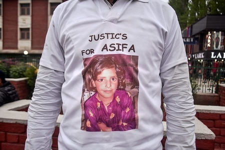 A demonstratorr wearing a T- shirt dipicting the picture of Asifa Bano during a protest in Srinagar, Indian administered Kashmir. The members of the Civil society and students in Kashmir on Monday held a peaceful demonstration demanding justice for Asifa Bano and action against the accused. Asifa Bano was gang-raped and murdered, in Kathua district of Jammu region in January 2018.