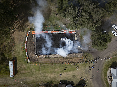 (EDITORS NOTE; Image taken with drone)
A burnout drift show is seen during the Mullet Fest Grand Final. The Mullet Fest Grand Final was held on December 7, 2024 at Hebburn Motorsport Park in Abermain. Contestants of all ages gathered to compete in various categories ranging from junior to senior and from everyday mullets to extreme mullets, celebrating the iconic hairstyle characterised by shorter hair at the front, top, sides and longer hair at the back.