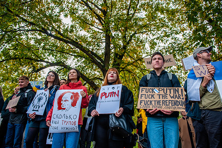 (EDITORS NOTE: Image contains profanity) Russian protesters are seen holding placards expressing their opinion during the demonstration. In front of the Russian Embassy, in the Hague, the Russian community in The Netherlands organized a protest against President Vladimir Putin’s decree to partially mobilize reservists in Russia, and against the war in Ukraine. Protests also took place across Russia where harsh laws against criticizing the military and the war, resulted in more than 1,300 Russians arrested in these anti-war demonstrations in 38 cities.