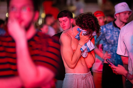 An England fan seen covering his face after England lost to Argentina in the World Cup semi-final. The sold-out Castlefield Bowl, organized by The Road to Victory, gathered thousands of fans for a public live screening to watch the semi-final match between England and Argentina in a World Cup battle for the first time since their unforgettable match in France '98. Final score: England 1:2 Argentina