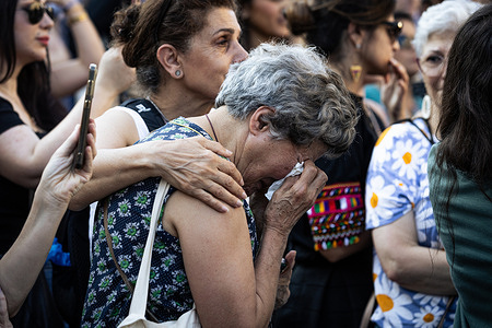 A woman gets emotional listening to chants of Iranian resistance during the demonstration for peace in the near and middle east at Place Pantheon. As the war between Israel and Iran escalates daily, a group of associations including Iran Justice organized a demonstration at the Pantheon Square in Paris to express their rejection of the conflict between Israel and Iran. Placing the Iranian and Israeli leaders Khamenei and Netanyahu for their failure to respect international law, the speakers including left wing MPs all called for an end to the war and respect for civilians and their rights.
