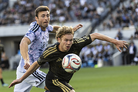 Los Angeles FC’s Jacob Shaffelburg (18) and San Jose Earthquakes’ Dave Romney (4) vie for the ball during an MLS soccer match at BMO Stadium on Sunday, April 19, 2026 in Los Angeles.