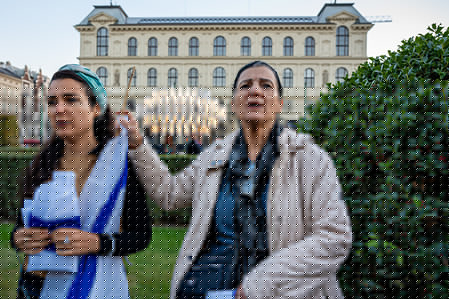 Two women seen with the flag of Israel at Jan Palach Square in Prague during a ceremony honouring the victims of the October 7, 2023 attacks in Israel. The attack which was carried out by the Palestinian militant group, Hamas from the Gaza Strip, resulted in the deaths of 1,205 people, most of them civilians. In response, Israel began military campaign on Gaza Strip. Various commemorations are taking place globally to mark the third anniversary of the Hamas attacks in Israel.