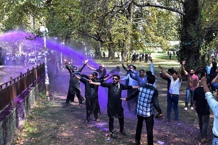 Kashmiri government teachers seen being sprayed with colored water by Indian government forces during the protest.
Kashmiri government teachers observed a teaching day as a black day while reiterating their demand of implementation of seventh pay commission and release of pending salaries, according to local news reports, the police resorted to cane-charge and detained dozens of teachers who were trying to march towards the governor house.