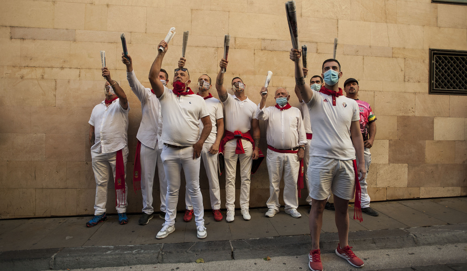 Bull runners sing the famous bull running song, dressed in white while wearing face masks during the event.
San Fermin festivities participants went to the Cuesta de Santo Domingo to remember the first bullfight held on 7th July 1591 following the suspension of the 2020 festivities due to the coronavirus crisis.