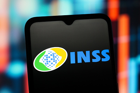 In this photo illustration, the INSS (Instituto Nacional do Seguro Social) logo is seen displayed on a smartphone screen.